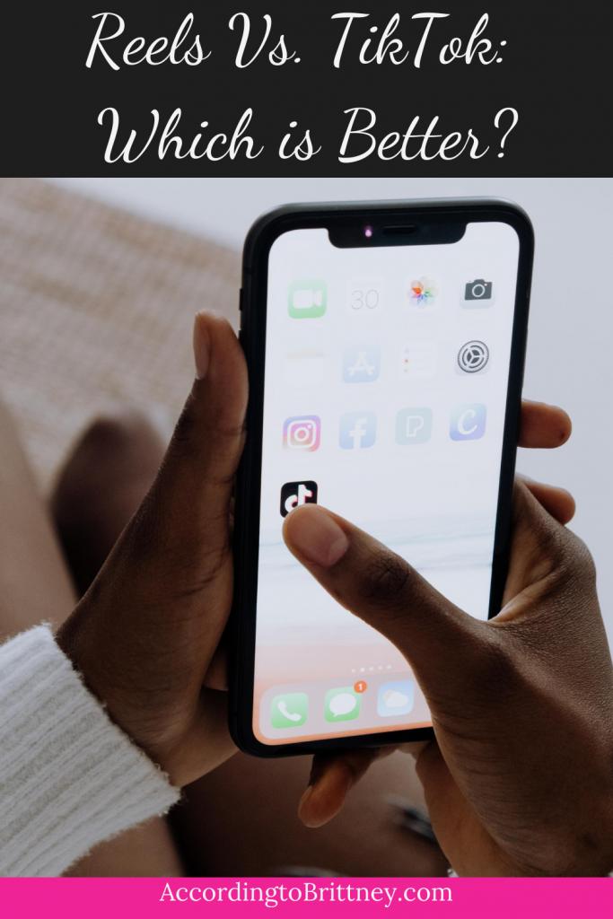 woman holding phone on tiktok app